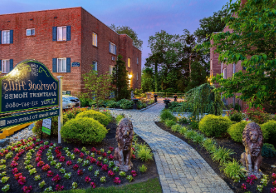 Entrance to Overlook apartments for rent surrounded by flowers in Abington, PA